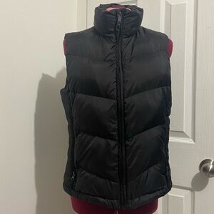 Burton (AK) women black zip down puffer vest. Size M.
